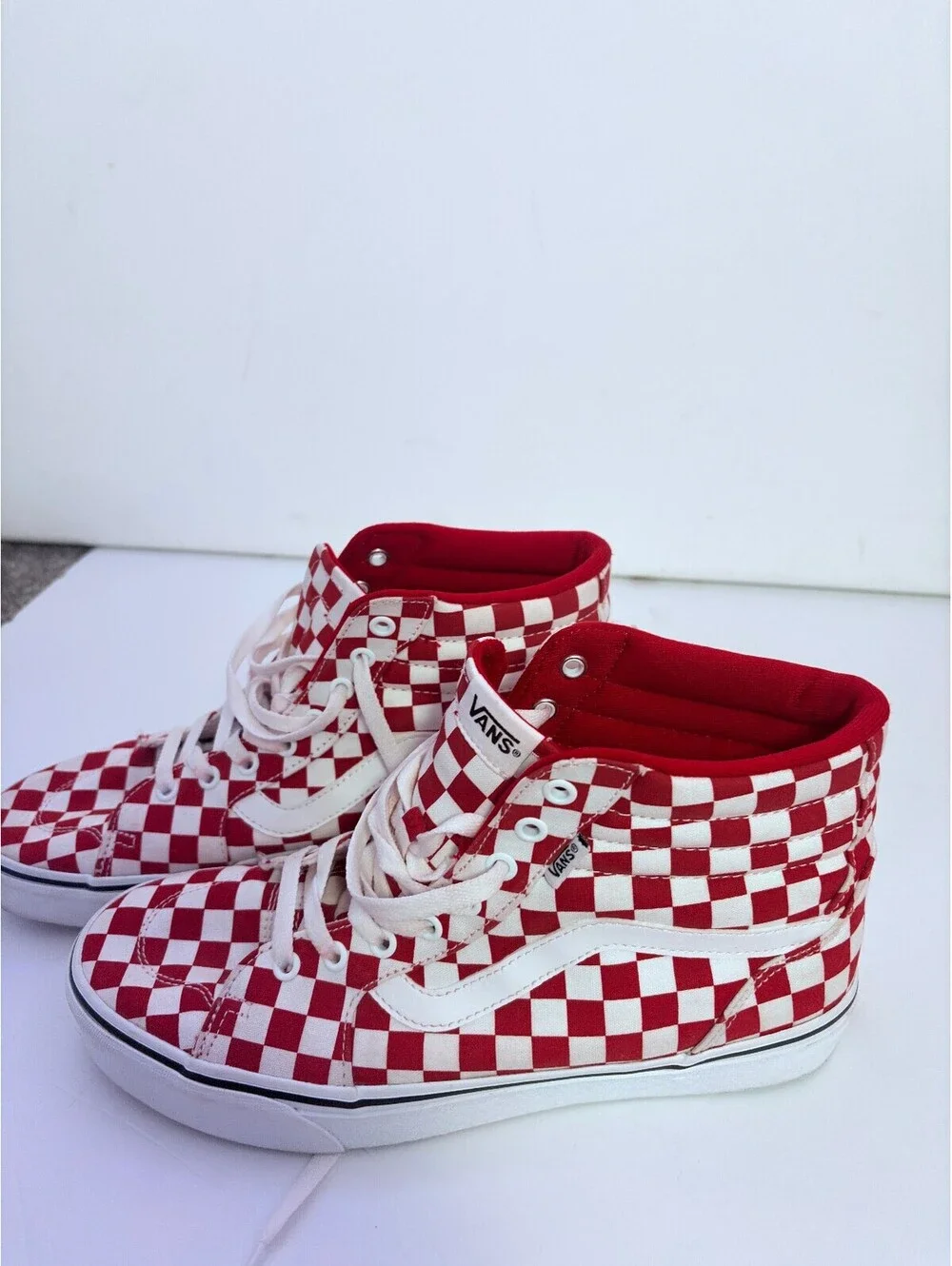 Vans red and white checkerboard high top sneakers
